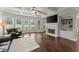 Living room with hardwood floors, fireplace, and high ceilings at 4562 Worthings Dr, Powder Springs, GA 30127