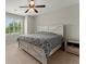 Main bedroom with large bed and window view at 4562 Worthings Dr, Powder Springs, GA 30127