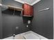 Convenient laundry room with dark gray walls and built-in shelving at 1938 Saxon Valley Ne Cir, Atlanta, GA 30319