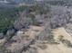 Aerial view shows multiple houses on a wooded lot at 337 Theodore Cox Cir, Canton, GA 30114