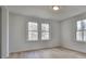 Spacious bedroom with hardwood floors and two windows at 337 Theodore Cox Cir, Canton, GA 30114