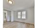 Well-lit bedroom with hardwood floors and access to bathroom at 337 Theodore Cox Cir, Canton, GA 30114