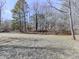 Mobile home surrounded by tall trees and a grassy area at 337 Theodore Cox Cir, Canton, GA 30114