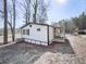 Another view of the home's exterior, showing the side and landscaping at 337 Theodore Cox Cir, Canton, GA 30114