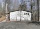 Side view of the house showcasing its siding and landscaping at 337 Theodore Cox Cir, Canton, GA 30114