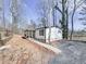 Single story home with a covered porch and wooded lot at 337 Theodore Cox Cir, Canton, GA 30114