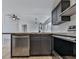 Modern kitchen with stainless steel appliances and dark cabinetry at 337 Theodore Cox Cir, Canton, GA 30114