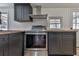 Stainless steel range and dark wood countertops in updated kitchen at 337 Theodore Cox Cir, Canton, GA 30114