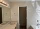 Bathroom with double vanity, large mirror, and separate tub and shower at 3763 Woodrose Ct, Snellville, GA 30039
