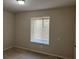 Bright bedroom with neutral walls, carpet, and a window with blinds at 3763 Woodrose Ct, Snellville, GA 30039