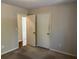 Simple bedroom with neutral walls and carpet, offering ample closet space at 3763 Woodrose Ct, Snellville, GA 30039