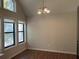Bright dining room with hardwood floors and a chandelier at 3763 Woodrose Ct, Snellville, GA 30039