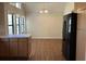 Dining area with hardwood floors and a view to the kitchen at 3763 Woodrose Ct, Snellville, GA 30039