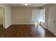 Bright entryway with hardwood floors and corner window at 3763 Woodrose Ct, Snellville, GA 30039