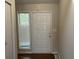 Front entry with white door and wood flooring at 3763 Woodrose Ct, Snellville, GA 30039