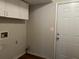 Laundry room with washer/dryer hookups and upper cabinets at 3763 Woodrose Ct, Snellville, GA 30039