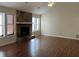 Spacious living room featuring a stone fireplace and hardwood floors at 3763 Woodrose Ct, Snellville, GA 30039