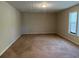 Spacious living room with carpeted floors and neutral walls at 3763 Woodrose Ct, Snellville, GA 30039