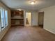 Living room with wet bar, built in cabinets, and carpeted floor at 3763 Woodrose Ct, Snellville, GA 30039