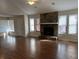 Spacious living room with stone fireplace and hardwood floors at 3763 Woodrose Ct, Snellville, GA 30039