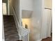 Upstairs hallway with carpeted stairs and neutral walls at 3763 Woodrose Ct, Snellville, GA 30039