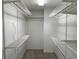 Large walk-in closet with wire shelving and hanging rods at 3763 Woodrose Ct, Snellville, GA 30039