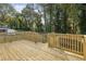 Spacious wooden deck overlooks backyard with wooden stairs and railing at 1732 Beecher Nw St, Atlanta, GA 30310