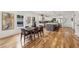 Open concept dining room with hardwood floors and farmhouse table at 1732 Beecher Sw St, Atlanta, GA 30310