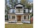 Two-story house with white siding, black accents, and a front porch at 1732 Beecher Nw St, Atlanta, GA 30310