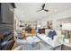 Open concept living room with hardwood floors and a fireplace at 1732 Beecher Nw St, Atlanta, GA 30310