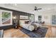 Spacious main bedroom with dark-colored accent wall and hardwood floors at 1732 Beecher Sw St, Atlanta, GA 30310