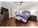 Bright bedroom with hardwood floors, ceiling fan, and ensuite bath at 332 Symphony Se Way, Smyrna, GA 30080