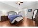 Spacious bedroom with hardwood floors and ceiling fan at 332 Symphony Se Way, Smyrna, GA 30080