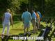 Golfers practicing on the driving range at Fox Creek at 332 Symphony Se Way, Smyrna, GA 30080