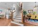 Open concept staircase separating the kitchen and dining areas at 332 Symphony Se Way, Smyrna, GA 30080