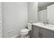 Clean bathroom with gray vanity and tiled floor at 5785 Stephens Mill Dr, Sugar Hill, GA 30518