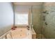 Relaxing bathroom with soaking tub and walk-in shower at 1765 Rubye Lee Ln, Dacula, GA 30019