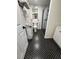 Cozy bathroom with stylish black hexagonal tiled floor and a sleek glass enclosed shower at 1765 Rubye Lee Ln, Dacula, GA 30019