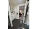 Bathroom with a view to a living area, with cabinets, mirror, and hexagonal tiled floor at 1765 Rubye Lee Ln, Dacula, GA 30019