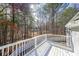 White deck overlooking wooded backyard, offering privacy and views at 1765 Rubye Lee Ln, Dacula, GA 30019