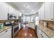 Kitchen with granite countertops and stainless steel appliances at 1765 Rubye Lee Ln, Dacula, GA 30019