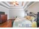 Main bedroom with wood floors and ceiling fan at 1765 Rubye Lee Ln, Dacula, GA 30019