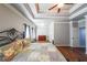 Main bedroom with tray ceiling, wood floors, and large windows at 1765 Rubye Lee Ln, Dacula, GA 30019