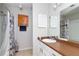 Bathroom with a shower-tub combination, a large mirror, and modern fixtures at 1850 Cashmere Ct, Lithonia, GA 30058