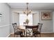 Cozy dining room with hardwood floors and a classic chandelier at 1850 Cashmere Ct, Lithonia, GA 30058