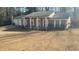 Brick ranch house with attached garage and front porch at 1850 Cashmere Ct, Lithonia, GA 30058