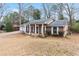 Lovely single-story home with a brick facade and a covered front porch, set on a grassy lawn at 1850 Cashmere Ct, Lithonia, GA 30058