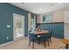 Charming breakfast nook with teal walls and a round table at 19 Camellia Dr, Fairburn, GA 30213