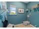 Laundry room with shelving, window, and light blue walls at 19 Camellia Dr, Fairburn, GA 30213