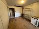 Unfinished basement room with storage shelving and brick wall at 2244 Alpha Dr, Decatur, GA 30032